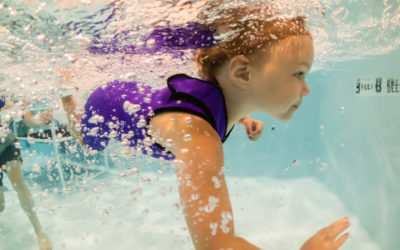 Why do we require children learn to swim without goggles?